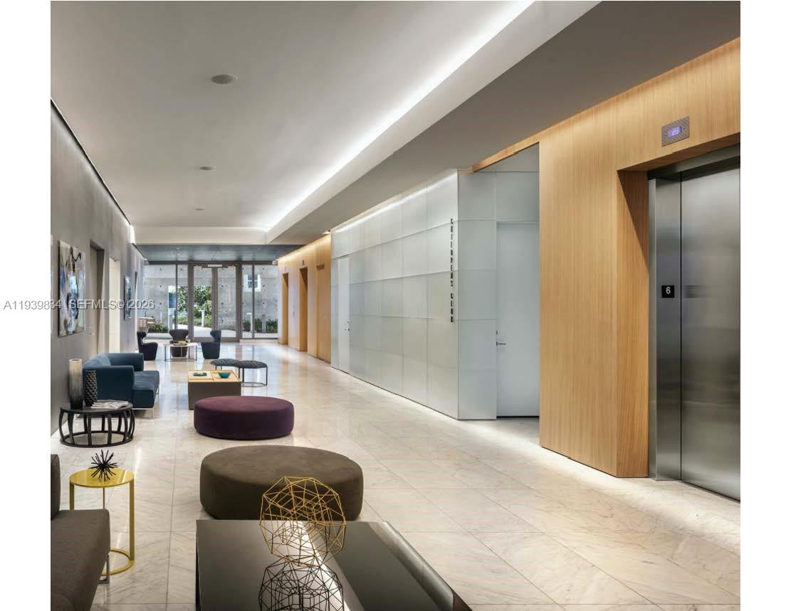 88 Southwest 7th Street, Unit 3403 Miami, FL 33130 - Photo 23 of 37 a living room with furniture and a large window