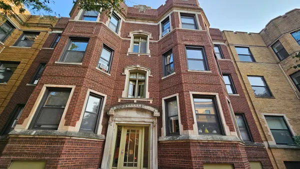 a front view of a multi story residential apartment building