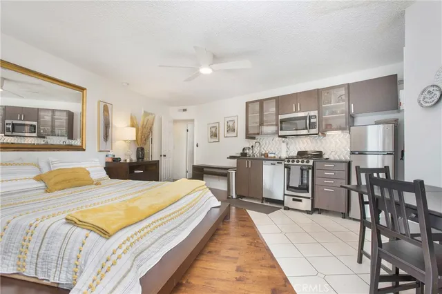 a bedroom with a bed and cabinets