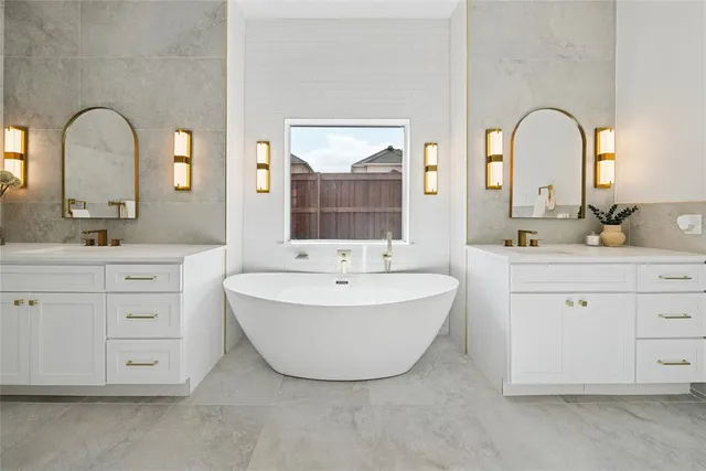 a white bath tub sitting next to a white sink
