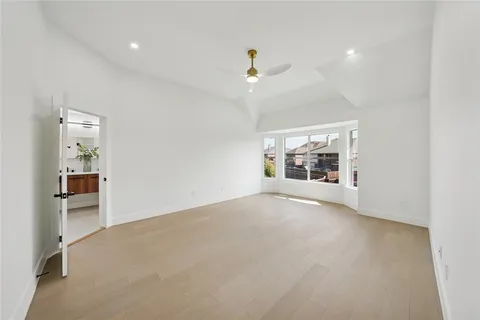 a bathroom with a double vanity sink mirror and bathtub