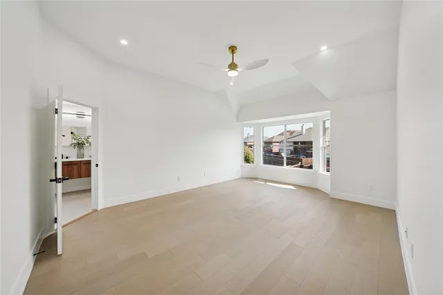 a bathroom with a double vanity sink mirror and bathtub
