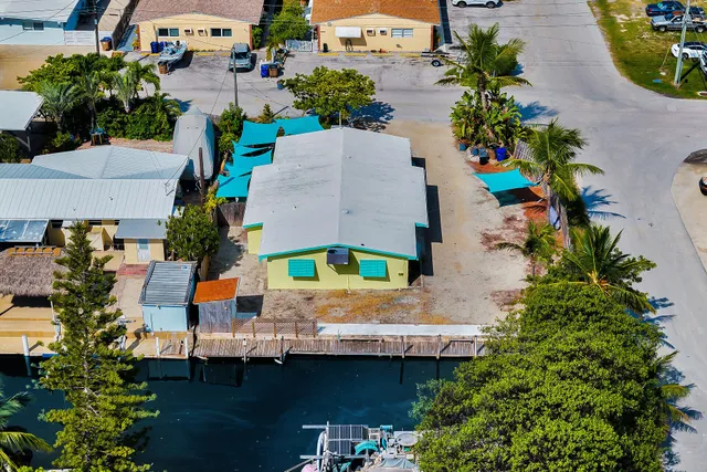 an aerial view of a house with outdoor space