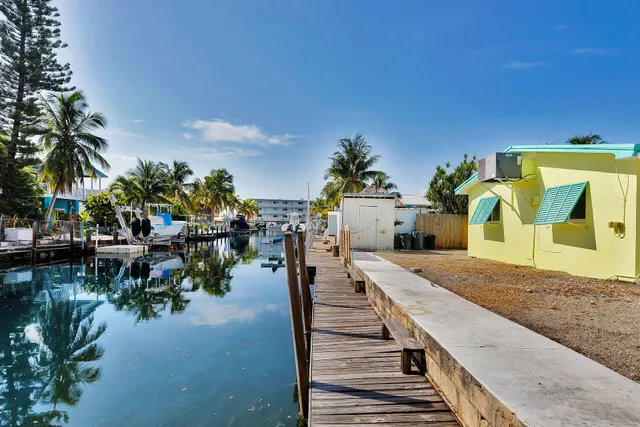 a utility room with multiple dryer and washer