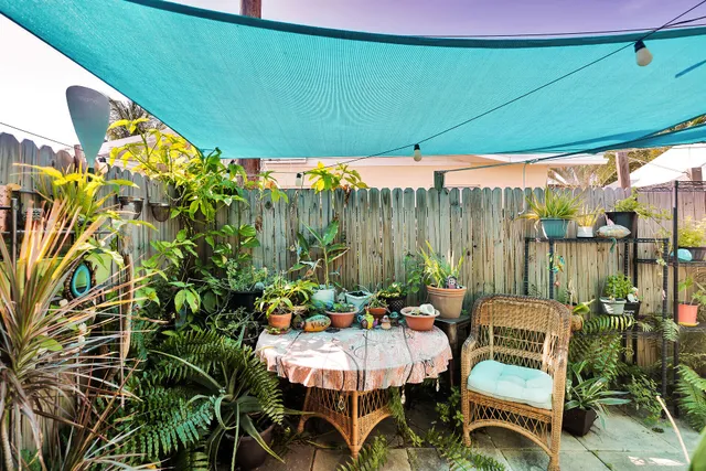 an aerial view of a houses with yard