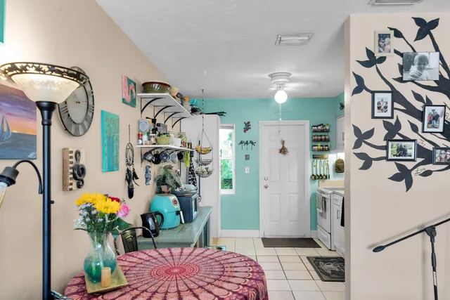 a kitchen with stainless steel appliances granite countertop a refrigerator a stove a sink and dishwasher