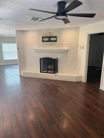 a view of a livingroom with wooden floor