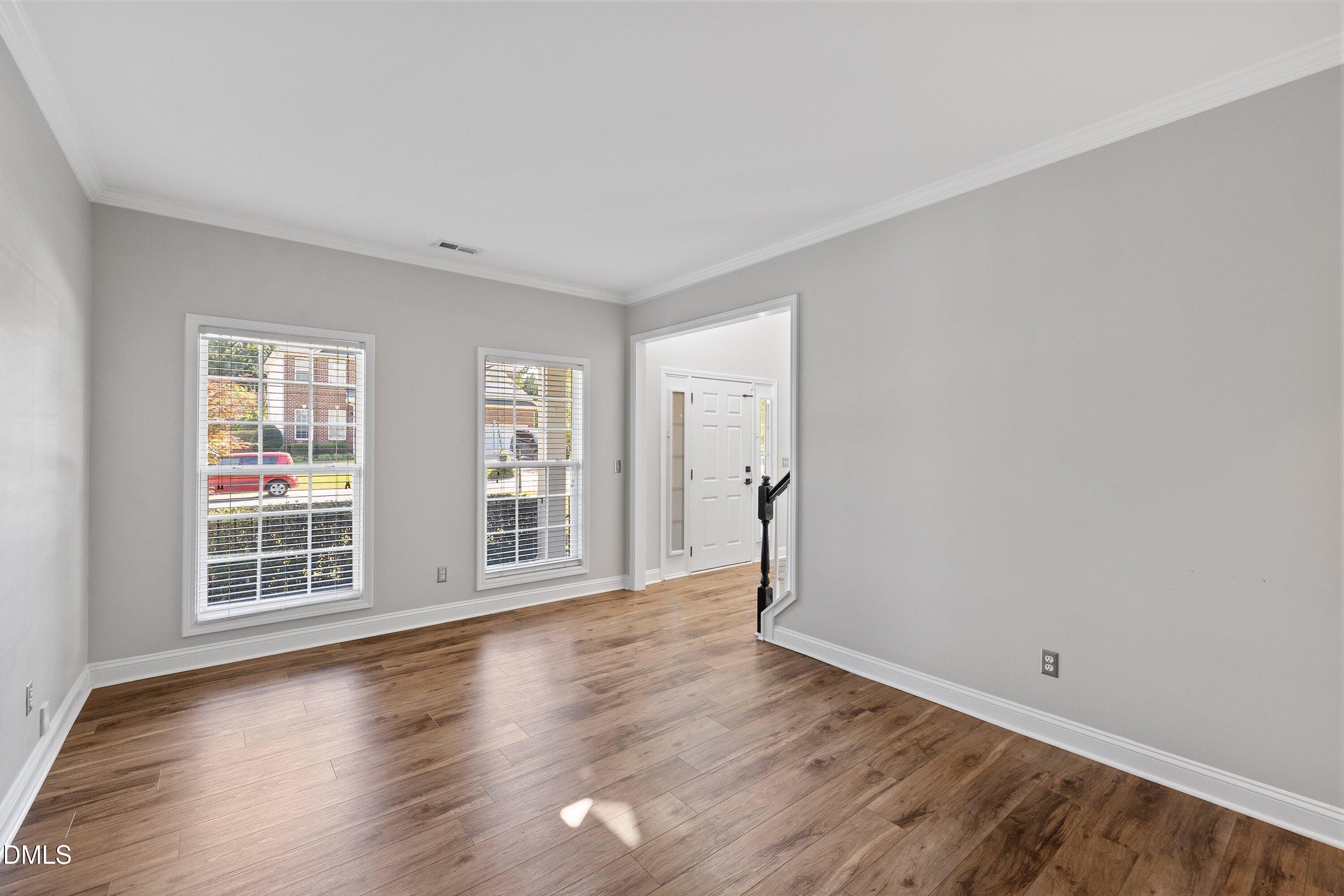 3717 Windmeade Road Wake Forest, NC 27587 - Photo 12 of 51 wooden floor in an empty room with a window