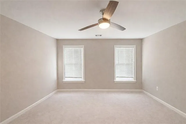 a bathroom with a toilet a sink and a mirror