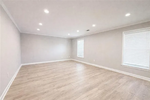 a view of kitchen with sink and refrigerator