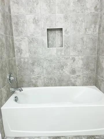 a bathroom with a toilet a sink and a mirror