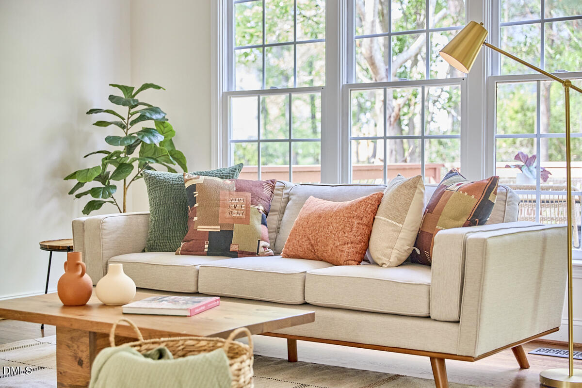 8030 Sundance Circle Durham, NC 27713 - Photo 19 of 61 a living room with furniture and a potted plant