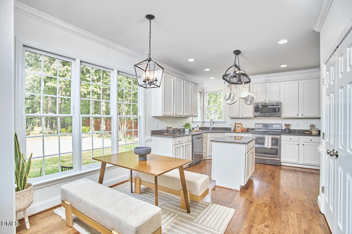 8030 Sundance Circle Durham, NC 27713 - Photo 25 of 61 a kitchen with a window and wooden floor
