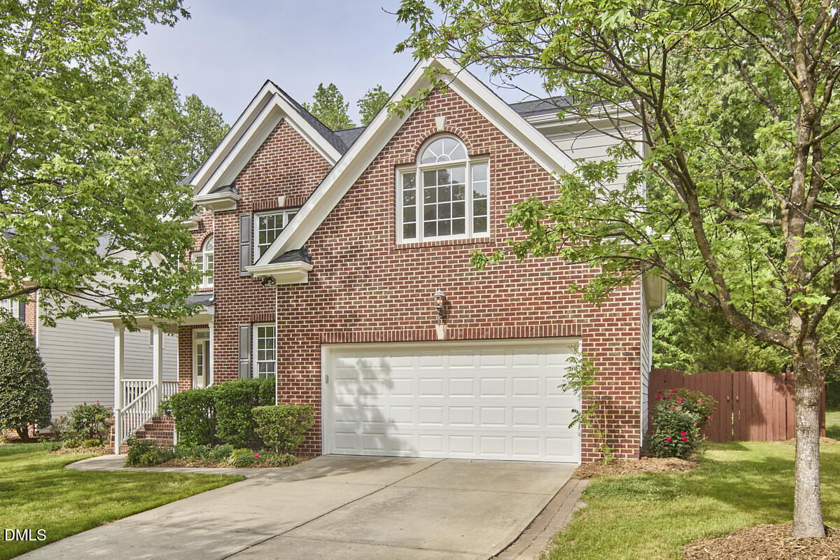 8030 Sundance Circle Durham, NC 27713 - Photo 4 of 61 a front view of a house with a yard