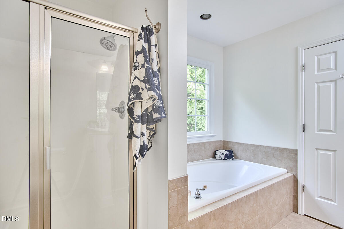 8030 Sundance Circle Durham, NC 27713 - Photo 43 of 61 a bathroom with a tub and shower