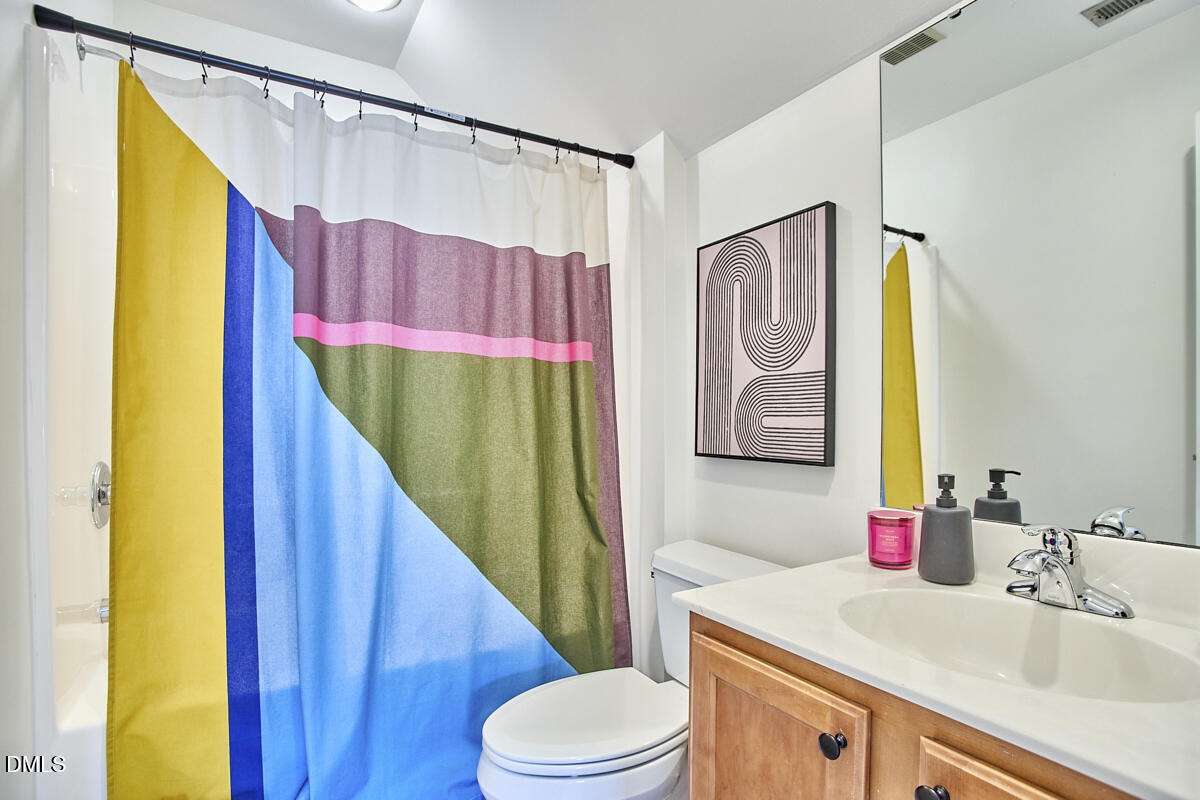 8030 Sundance Circle Durham, NC 27713 - Photo 50 of 61 a bathroom with a sink vanity mirror and toilet