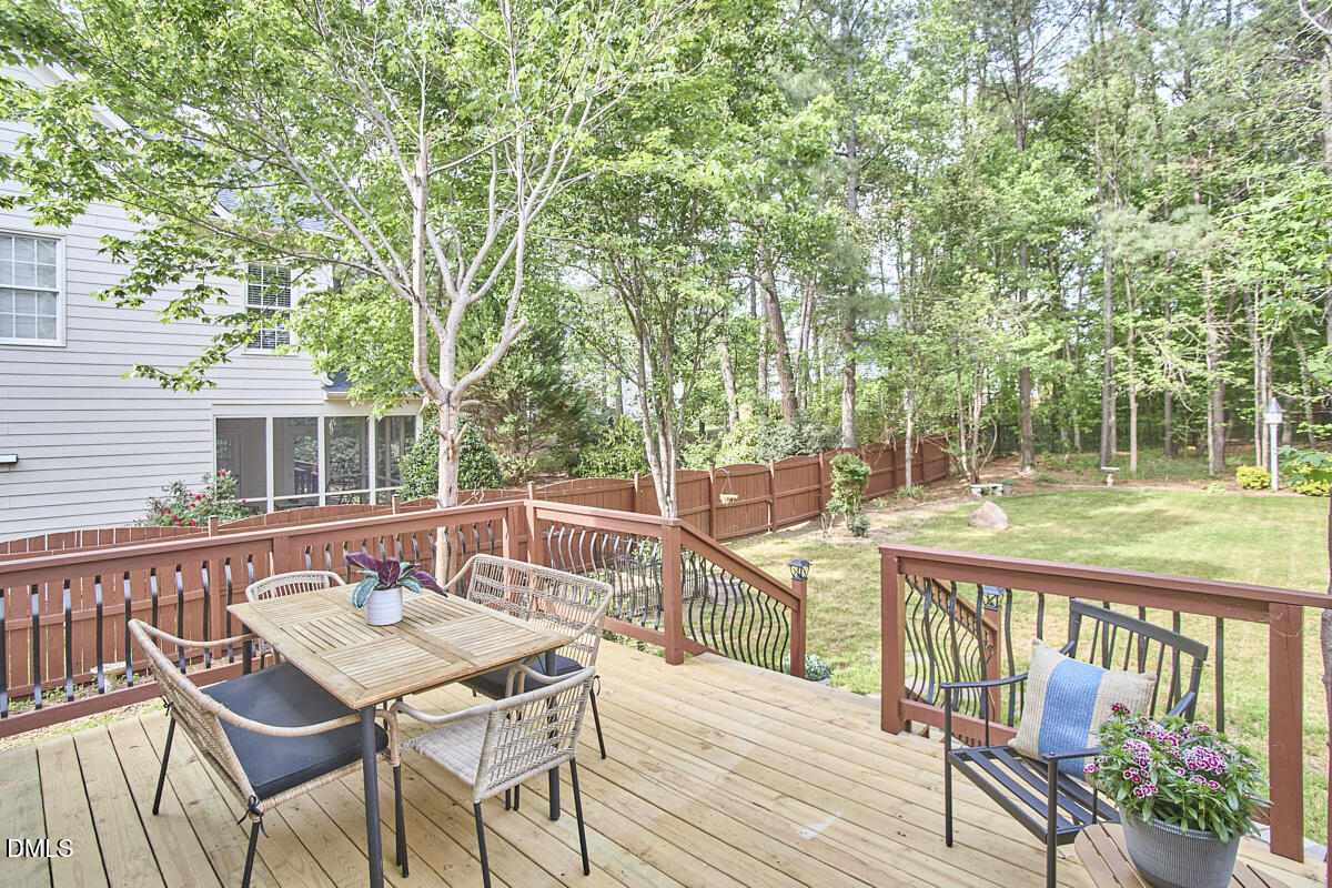 8030 Sundance Circle Durham, NC 27713 - Photo 52 of 61 a view of a patio with a table and chairs