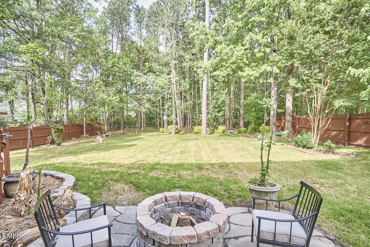 8030 Sundance Circle Durham, NC 27713 - Photo 54 of 61 a view of a chair and table on the garden