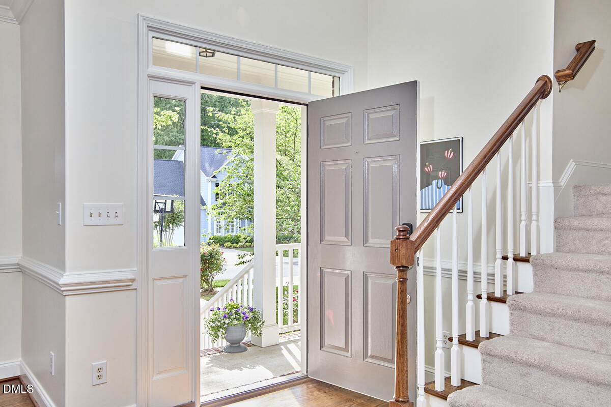 8030 Sundance Circle Durham, NC 27713 - Photo 7 of 61 a view of entryway with wooden floor and stairs