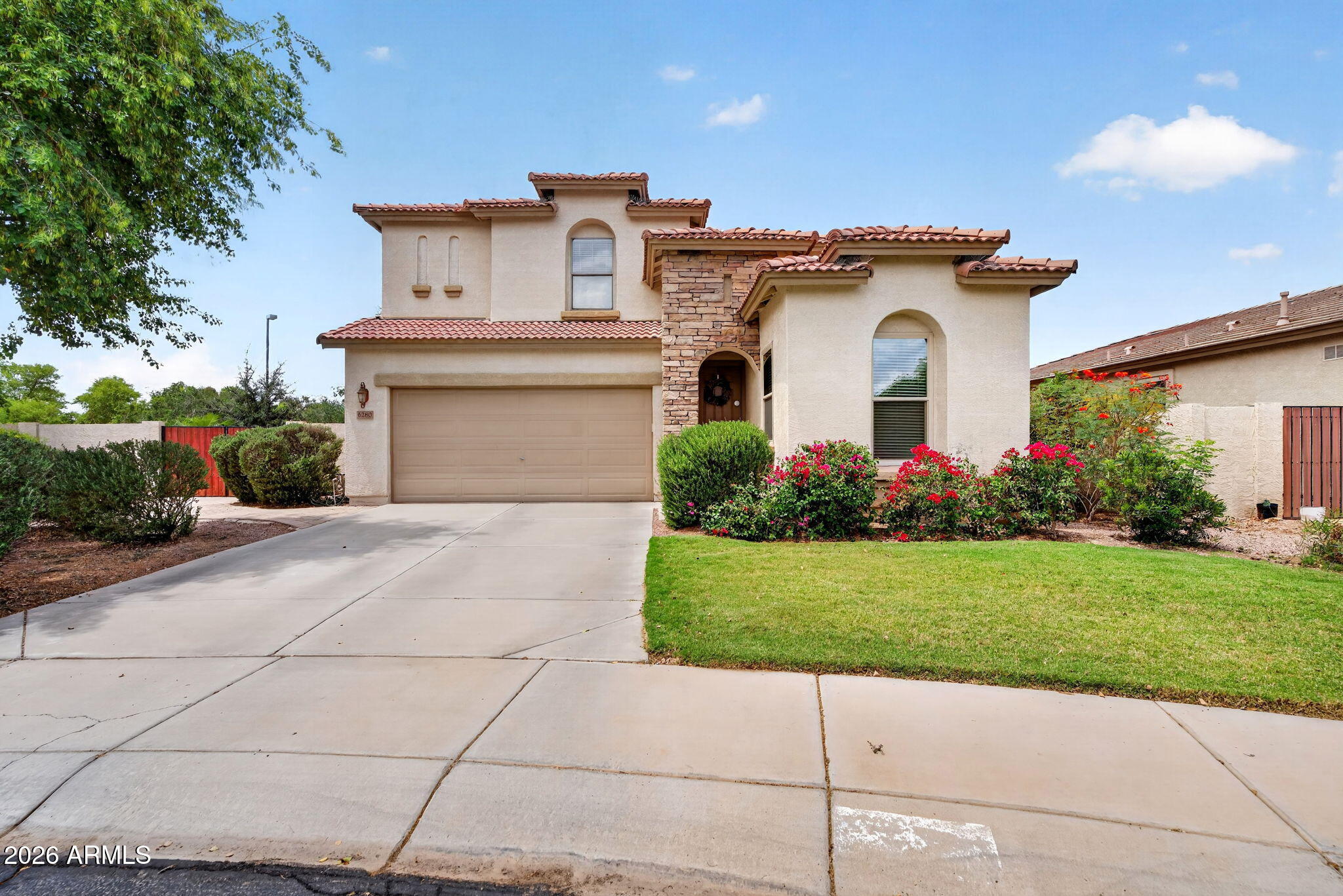 6280 South Sinova Court Gilbert, AZ 85298 - Photo 1 of 64 a white building with a clock tower in the middle in front of it