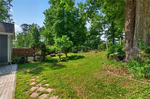a backyard of a house with lots of green space