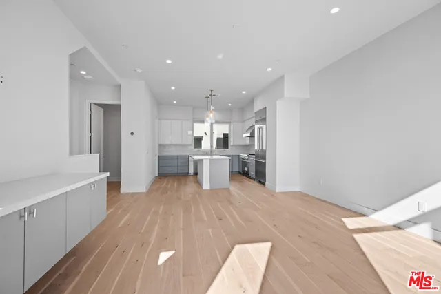 a view of kitchen with wooden floor