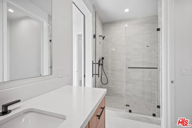 a view of a balcony with floor and white walls