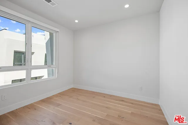 a bathroom with a sink toilet a mirror and shower