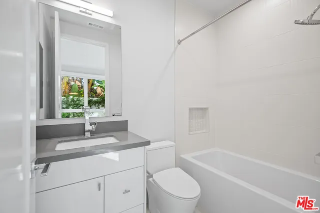 a bathroom with a sink toilet and bathtub