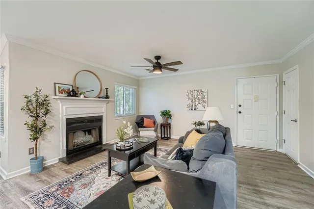 a living room with furniture and a fireplace