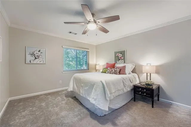 a spacious bedroom with a bed and window