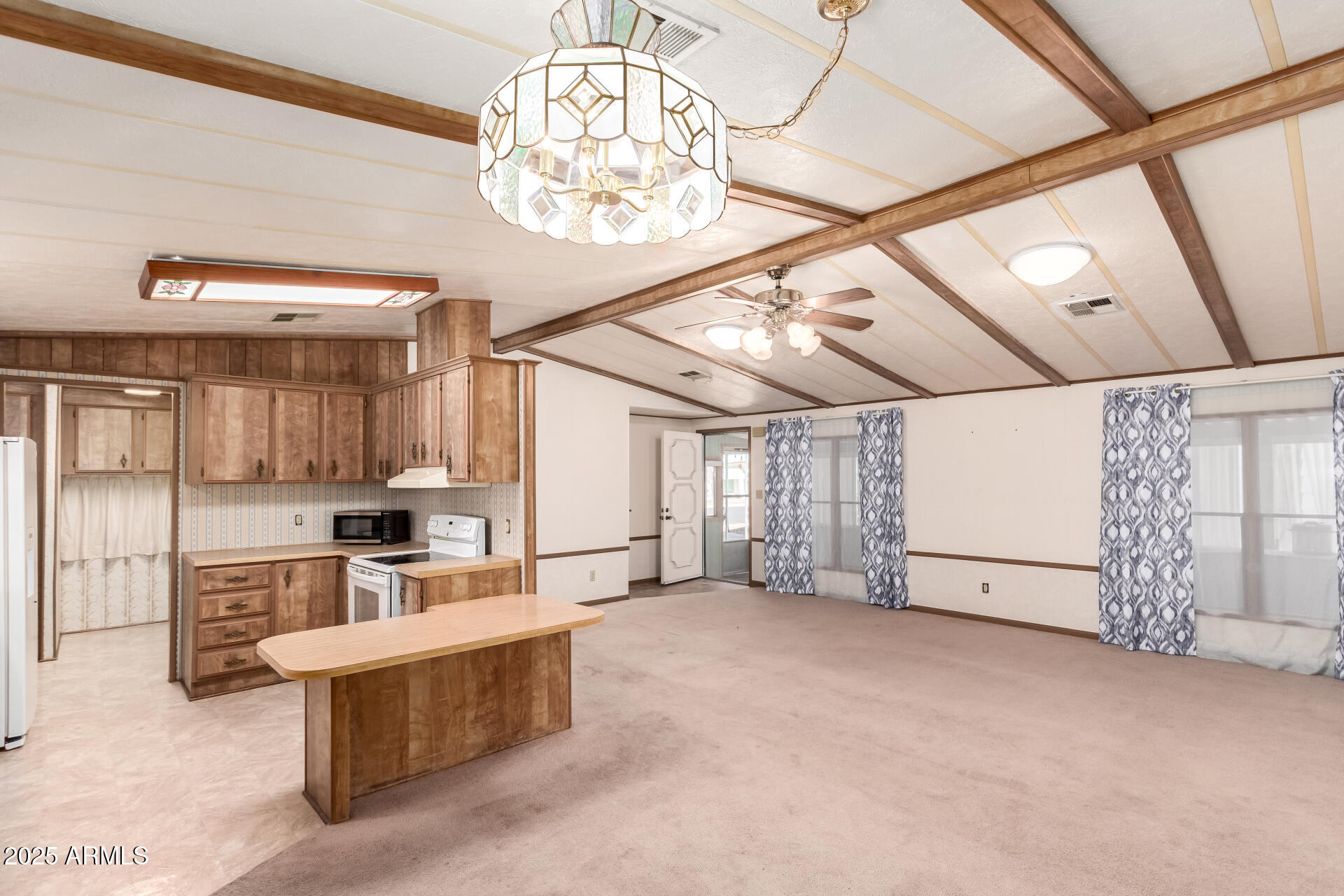 2100 North Trekell Road, Unit 229 Casa Grande, AZ 85122 - Photo 12 of 30 a view of a kitchen with microwave and cabinets