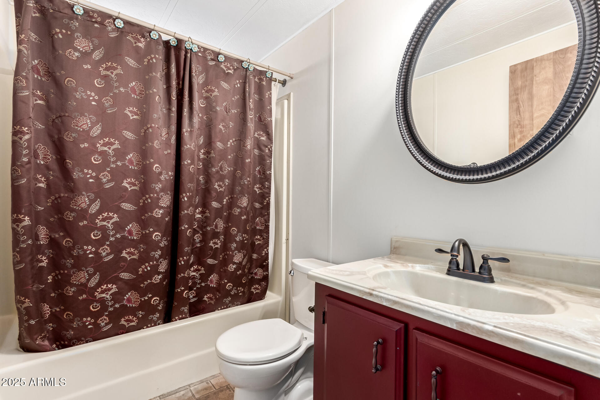 2100 North Trekell Road, Unit 229 Casa Grande, AZ 85122 - Photo 25 of 30 a bathroom with a sink a toilet and a mirror