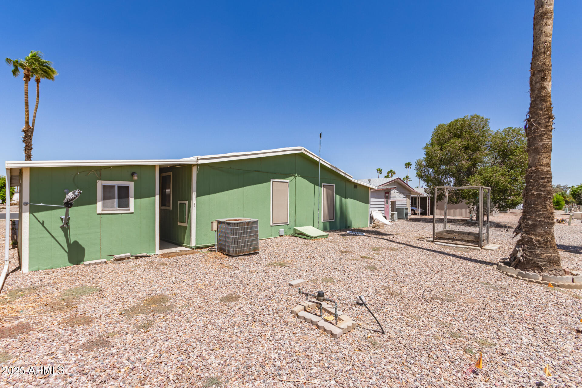 2100 North Trekell Road, Unit 229 Casa Grande, AZ 85122 - Photo 29 of 30 a front view of a house with a yard and garage