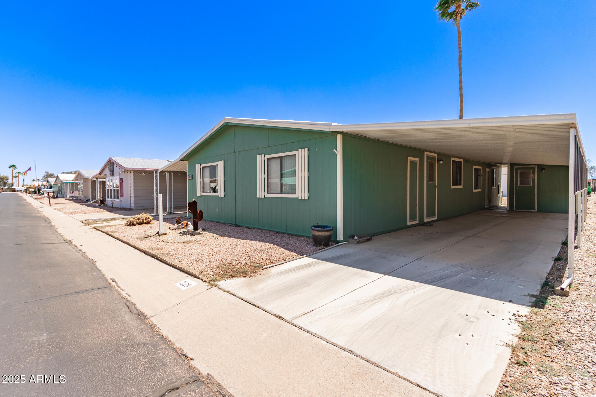 2100 North Trekell Road, Unit 229 Casa Grande, AZ 85122 - Photo 4 of 30 a front view of a house with a yard
