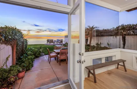 a view of a deck with wooden floor and outdoor seating