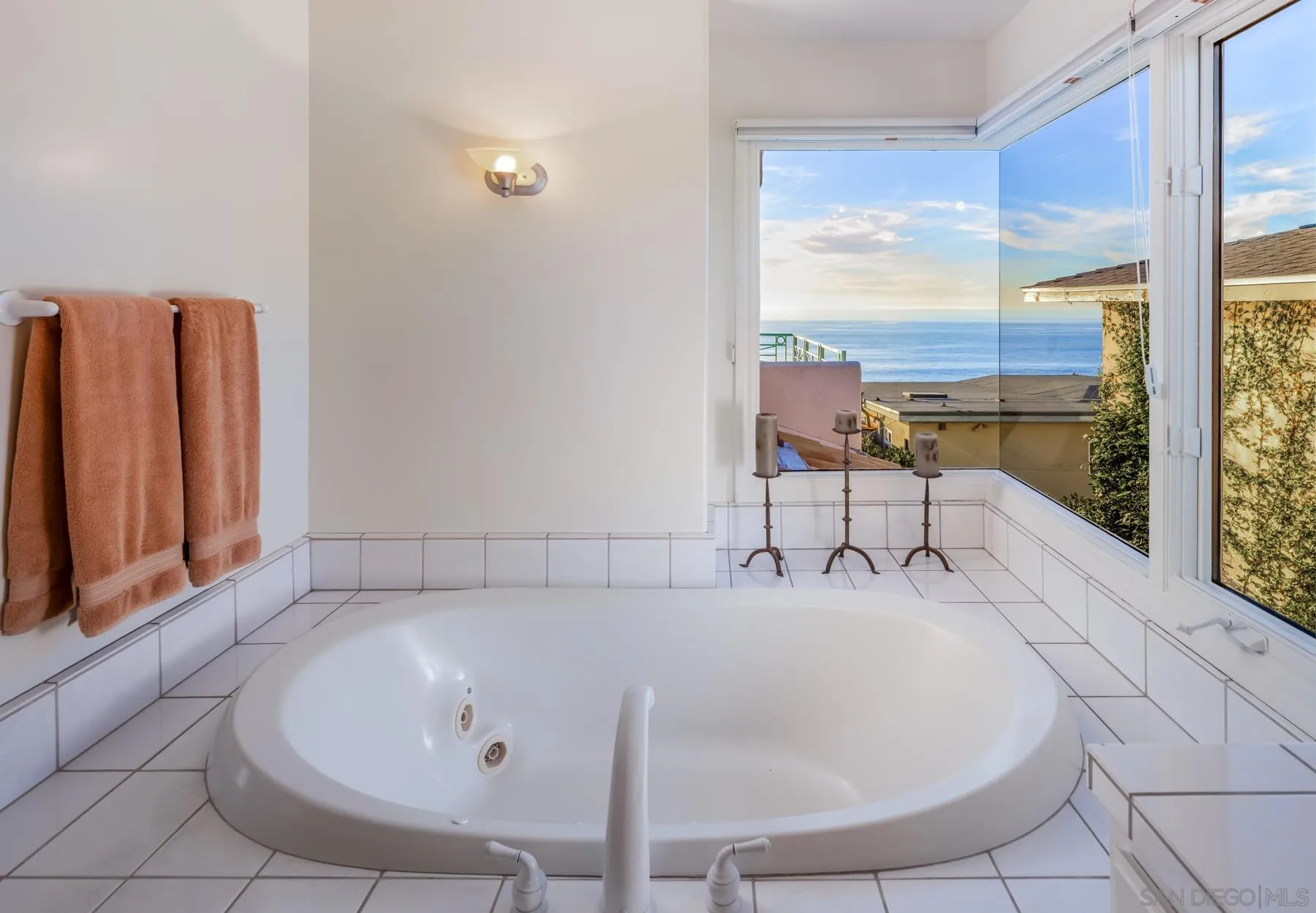538 4th Street Encinitas, CA 92024 - Photo 22 of 35 a white bath tub sitting in a bathroom next to a window