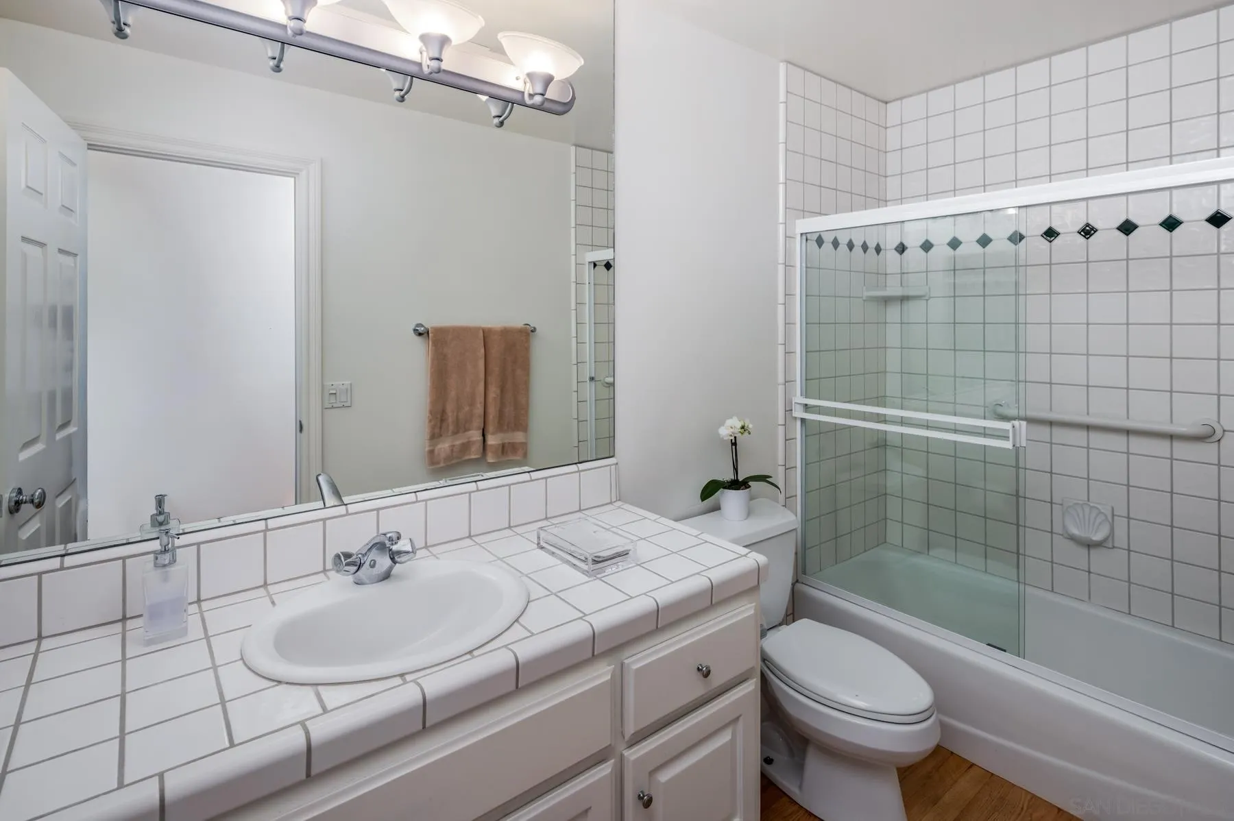 538 4th Street Encinitas, CA 92024 - Photo 24 of 35 a bathroom with a sink toilet and shower