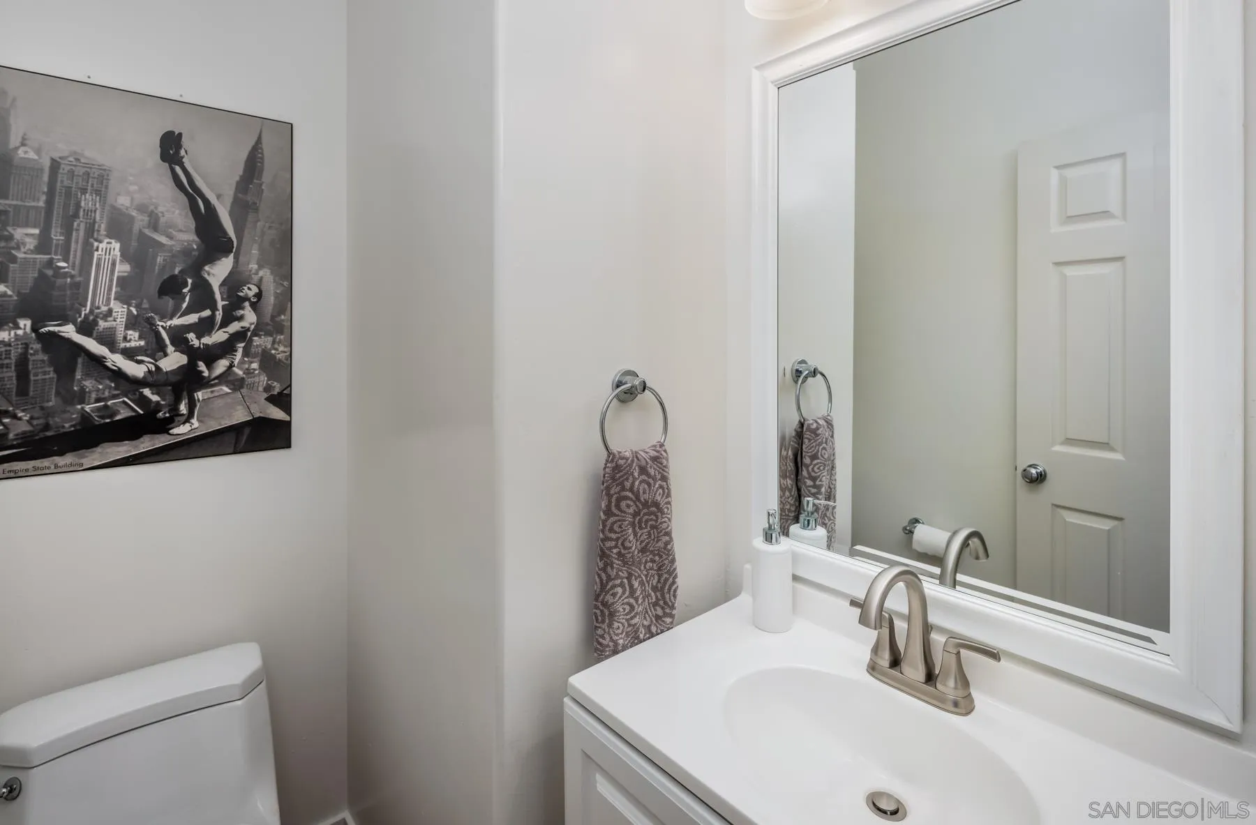 538 4th Street Encinitas, CA 92024 - Photo 28 of 35 a bathroom with a sink and a mirror