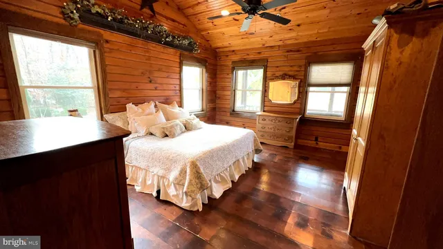 a bedroom with a bed and a table