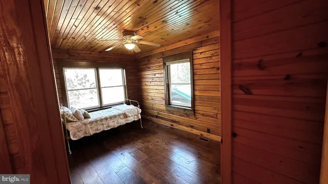 a bedroom with furniture and a window