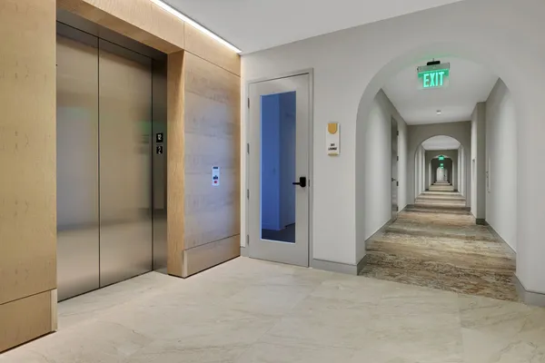 a view of a hallway with front door