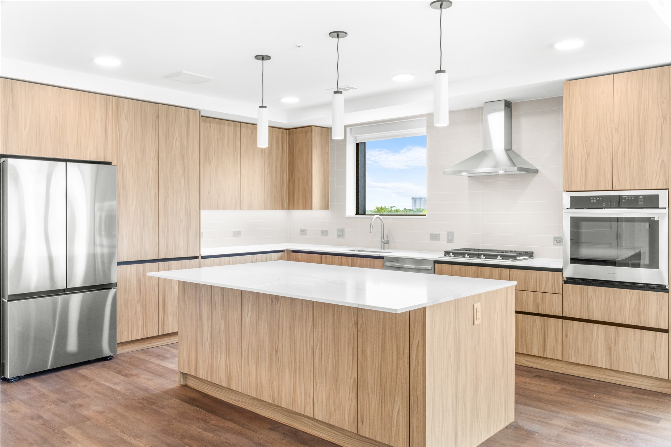 2311 Westheimer Road, Unit 529 Houston, TX 77098 - Photo 5 of 33 a kitchen with stainless steel appliances granite countertop a refrigerator a sink dishwasher a stove and a refrigerator