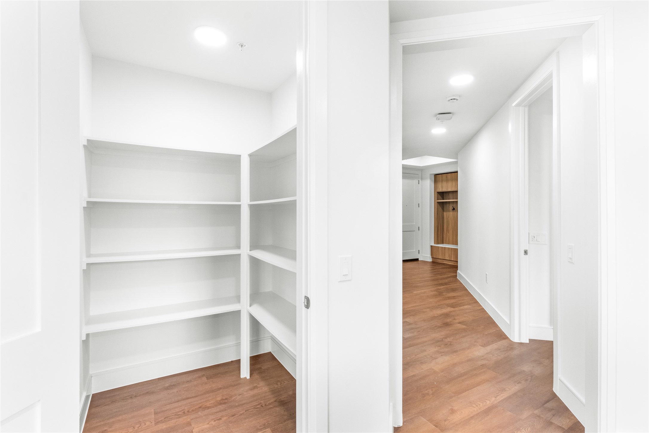 2311 Westheimer Road, Unit 529 Houston, TX 77098 - Photo 8 of 33 a view of a hallway with wooden floor and staircase