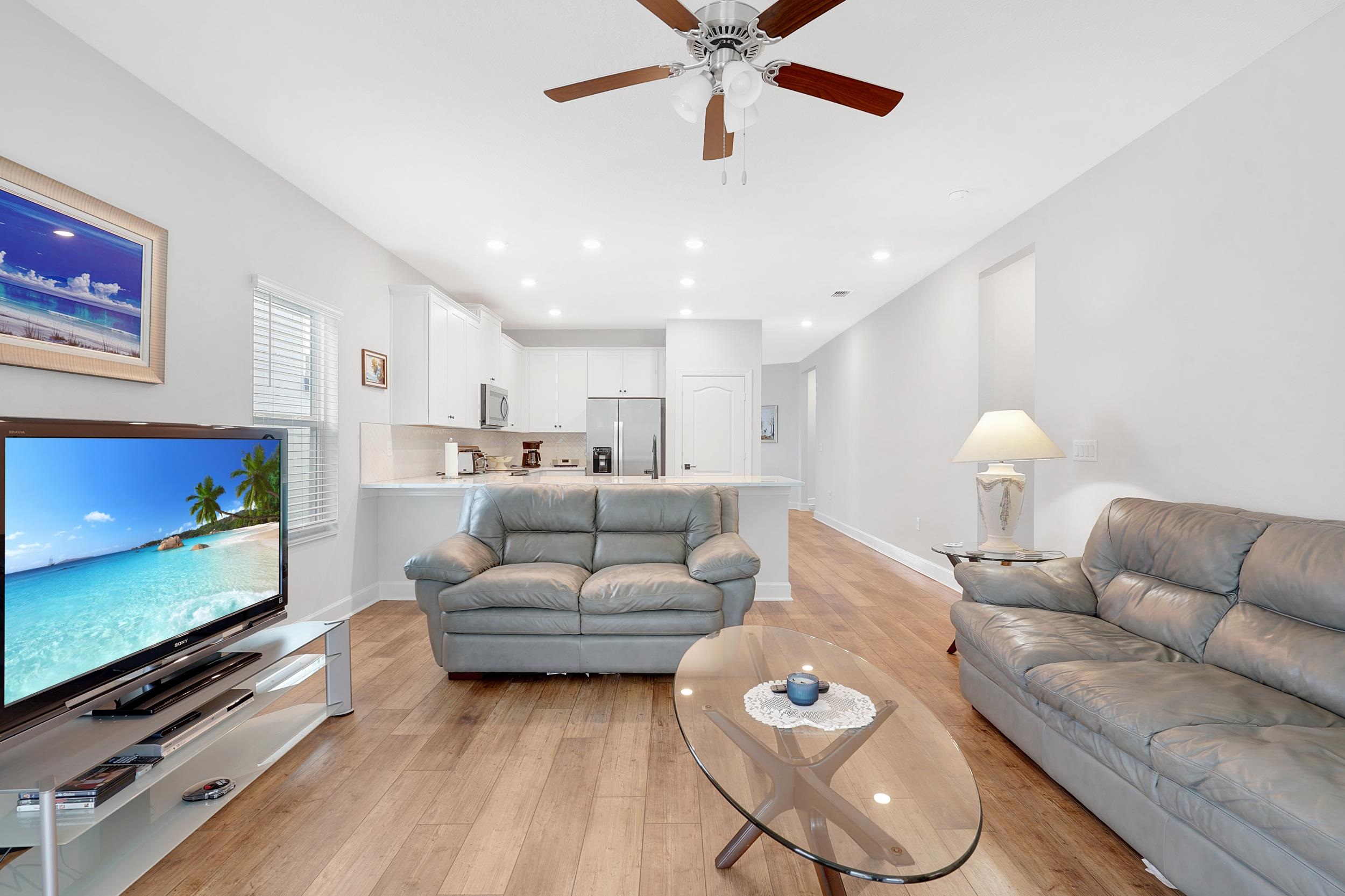 1014 Morgans Treasure Road St. Augustine, FL 32084 - Photo 10 of 31 a living room with furniture and a flat screen tv