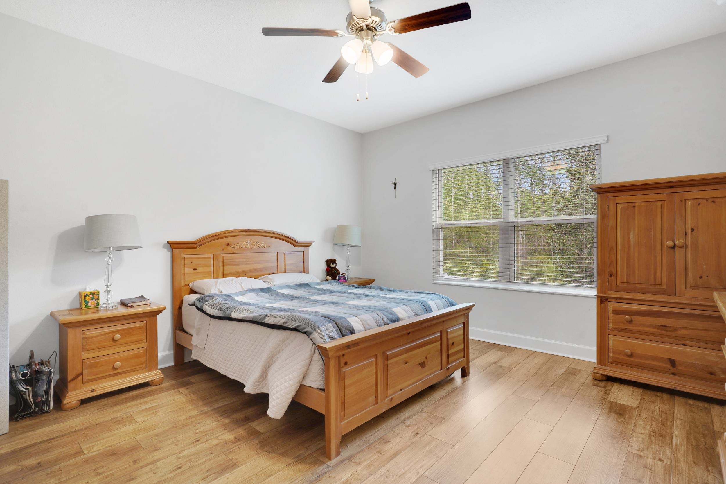 1014 Morgans Treasure Road St. Augustine, FL 32084 - Photo 11 of 31 a bedroom with a bed and window