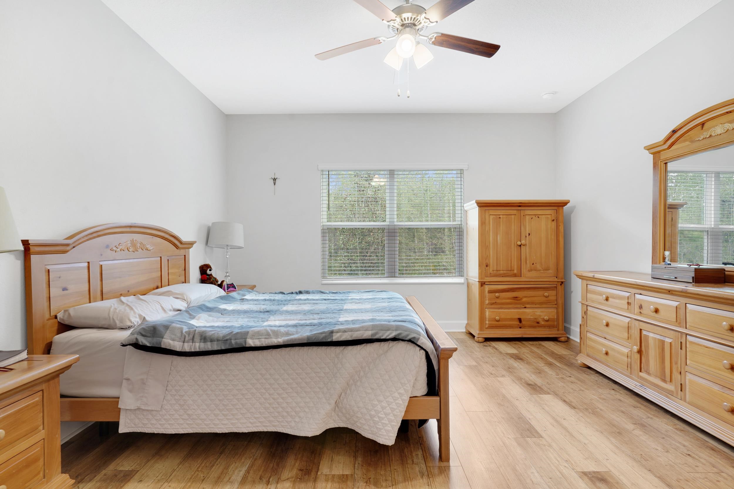 1014 Morgans Treasure Road St. Augustine, FL 32084 - Photo 12 of 31 a bedroom with a bed and dresser