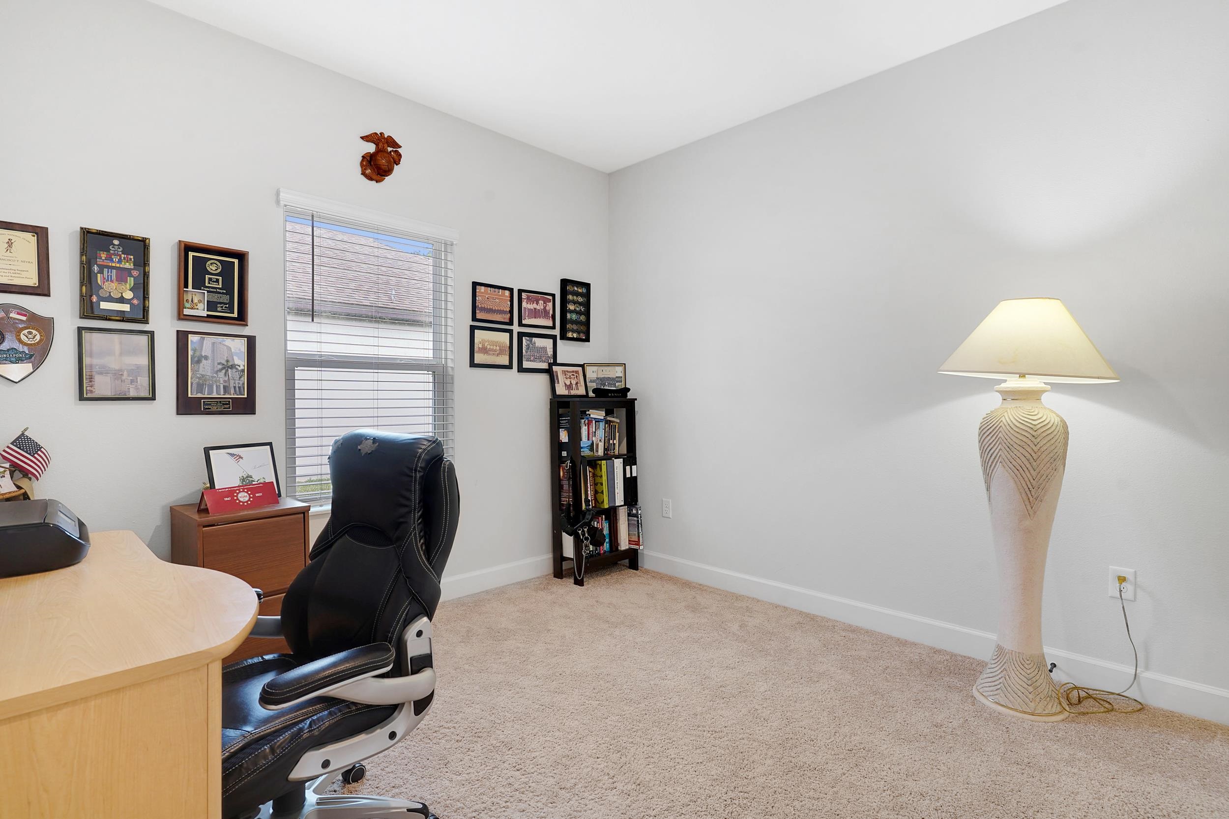 1014 Morgans Treasure Road St. Augustine, FL 32084 - Photo 17 of 31 a room with furniture and a lamp