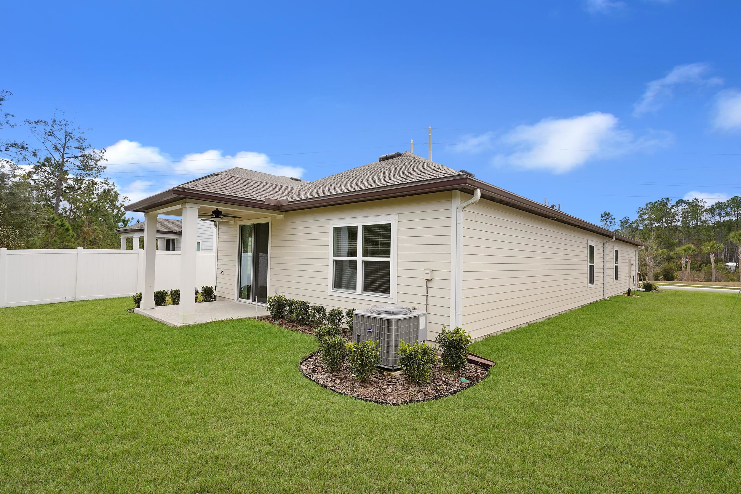 1014 Morgans Treasure Road St. Augustine, FL 32084 - Photo 26 of 31 a front view of house with yard and green space