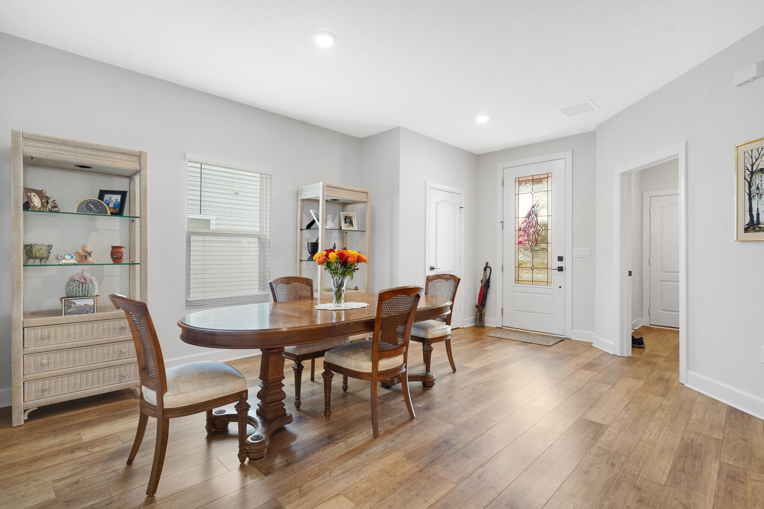 1014 Morgans Treasure Road St. Augustine, FL 32084 - Photo 4 of 31 a dining room with furniture and wooden floor